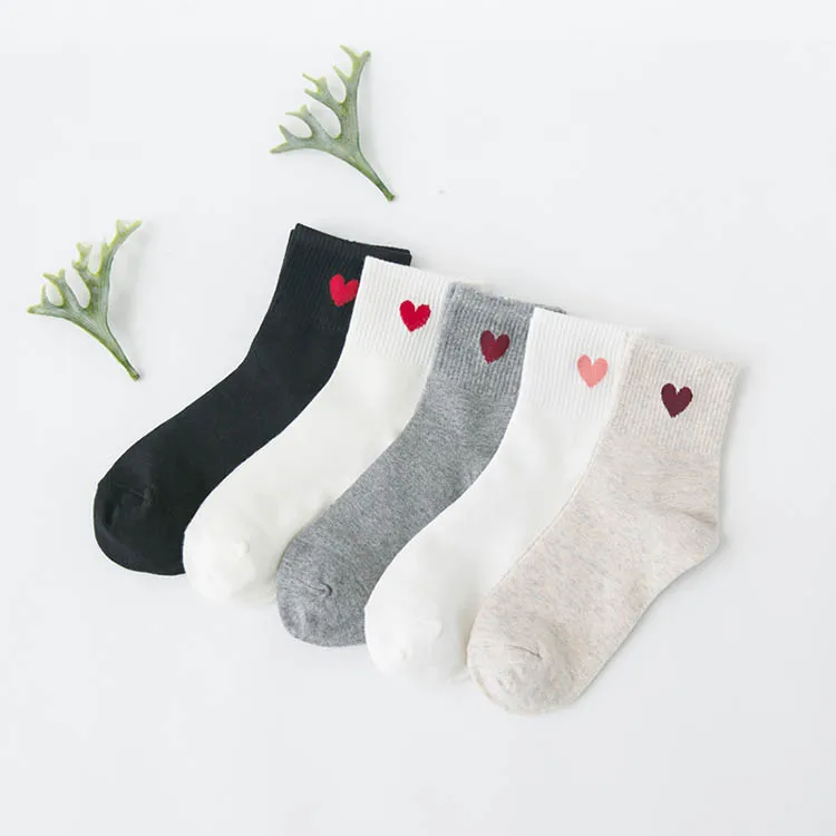 Hb2732fdb067e403f81cd902ea756cf6a2.webp Wholesale Customized White Women's Crew Socks with Heart Pattern for Autumn Season Bottom Logo Position - Image 1